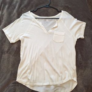 Plain white tee with a front pocket and v-neck.